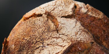 The golden crust of a steam baked load of bread