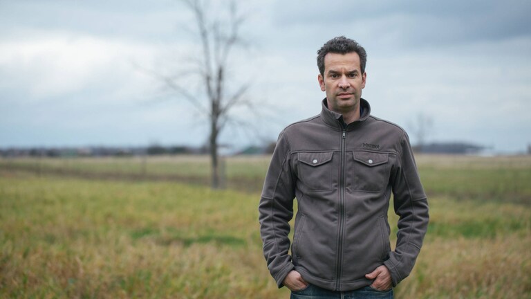 Mark Schatzker in a grassy field