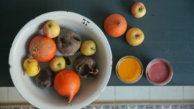 A bowl of organic fruits such a oranges